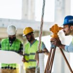 Portrait of construction engineers working on building site