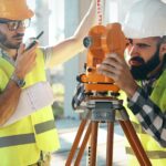 Portrait of construction engineers working on building site